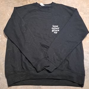 "Love Never Gives Up" sweatshirt